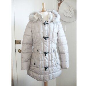 Long winter puffer coat with duffle button design with a zip closure